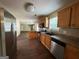 Modern kitchen features stainless steel appliances, wood cabinets, and barstool seating at 257 Juliet Dr, Hampton, GA 30228