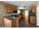 Kitchen featuring wood cabinets, stainless steel appliances, and an adjoining dining area at 257 Juliet Dr, Hampton, GA 30228