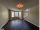 Bright and spacious living area featuring a staircase and bay window at 257 Juliet Dr, Hampton, GA 30228