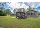 Outdoor patio with a pergola, large table and chairs, and huge lawn area at 105 Greenfield Cir, Fayetteville, GA 30215
