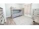 This bedroom features a bunk bed, light blue walls and gray wood floors at 105 Greenfield Cir, Fayetteville, GA 30215