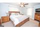 Comfortable bedroom featuring a large bed, carpet flooring, and natural light from the windows at 105 Greenfield Cir, Fayetteville, GA 30215