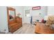 Entryway features wooden bench with mirror, wooden desk, white door and wood floors at 105 Greenfield Cir, Fayetteville, GA 30215