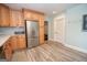 Spacious kitchen featuring stainless steel refrigerator, wood cabinets and a pantry at 105 Greenfield Cir, Fayetteville, GA 30215
