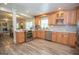 A charming kitchen featuring stainless steel appliances, wood cabinets, and a tile backsplash at 105 Greenfield Cir, Fayetteville, GA 30215