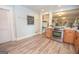 Open kitchen with stainless steel oven, wood cabinets and a chalkboard wall accent at 105 Greenfield Cir, Fayetteville, GA 30215