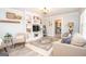 Stylish living room featuring built-in shelves and wood-look floors at 105 Greenfield Cir, Fayetteville, GA 30215