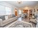 Open-concept living area with wood flooring flowing into the dining and kitchen spaces at 105 Greenfield Cir, Fayetteville, GA 30215