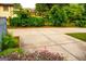 Home's driveway is surrounded by lush greenery and mature trees, enhancing privacy at 625 Chestnut St # D, Hapeville, GA 30354