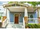 Inviting front porch with stone accents and craftsman details enhance the curb appeal at 625 Chestnut St # D, Hapeville, GA 30354
