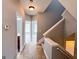 Hallway with neutral walls, carpet, staircase and doorways that show access to rooms in the home at 625 Chestnut St # D, Hapeville, GA 30354