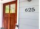 Close up view of house number 625 on a light blue home at 625 Chestnut St # D, Hapeville, GA 30354