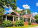 This restaurant features ample greenery, a clear sign, and a unique design at 625 Chestnut St # D, Hapeville, GA 30354