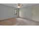 This bedroom offers carpeted floors, a window, and neutral wall paint at 105 Gleneagles Pt, Peachtree City, GA 30269
