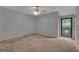 Bedroom with neutral carpet and a ceiling fan at 105 Gleneagles Pt, Peachtree City, GA 30269