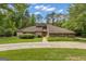 Charming single-story home with stone accents, inviting curb appeal, and a well-manicured lawn at 105 Gleneagles Pt, Peachtree City, GA 30269