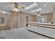 Bright kitchen with a center island, white cabinets, and a functional layout offering a practical space for cooking and dining at 105 Gleneagles Pt, Peachtree City, GA 30269