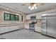 Spacious kitchen featuring an island, white cabinets, and stainless steel appliances for modern convenience and ample counter space at 105 Gleneagles Pt, Peachtree City, GA 30269