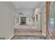 View of the living room with a stone fireplace, neutral walls, and carpeted flooring at 105 Gleneagles Pt, Peachtree City, GA 30269