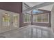 Bright sunroom with tile flooring and lots of natural light from doors and windows to create a relaxing area at 105 Gleneagles Pt, Peachtree City, GA 30269