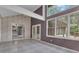 Sunroom featuring large windows, vaulted ceilings, and view into the kitchen at 105 Gleneagles Pt, Peachtree City, GA 30269