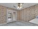 Bright sunroom with tile flooring and lots of natural light from doors and windows to create a relaxing area at 105 Gleneagles Pt, Peachtree City, GA 30269
