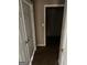 View into a closet featuring carpeted floors and shelving, offering ample storage space at 621 Ridge Creek Dr, Clarkston, GA 30021
