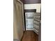 Kitchen area with a refrigerator and ample cabinet space, designed for efficient meal preparation at 621 Ridge Creek Dr, Clarkston, GA 30021