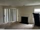 Living room with sliding glass doors and fireplace, offering a comfortable space for relaxation and entertaining at 621 Ridge Creek Dr, Clarkston, GA 30021
