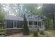 Inviting home showcasing a covered porch, mature landscaping, and classic architectural details at 686 Favorwood Sw Dr, Marietta, GA 30060