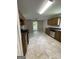 Well-lit kitchen featuring tile floors, stainless steel appliances, and a ceiling fan at 686 Favorwood Sw Dr, Marietta, GA 30060