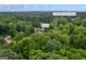 Aerial view in Kennesaw, GA, showing the proximity to Lewis Elementary School and surrounded by lush green trees at 3924 Lorien Nw Way, Kennesaw, GA 30152