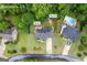 Aerial view in Kennesaw, GA showing home and fire pit with lush trees and surrounding area at 3924 Lorien Nw Way, Kennesaw, GA 30152