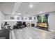 Finished basement area features multiple desks, chairs, and natural light at 3924 Lorien Nw Way, Kennesaw, GA 30152