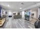 Finished basement with large media screen, cozy seating, and gray flooring at 3924 Lorien Nw Way, Kennesaw, GA 30152