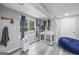 Finished basement area with natural light, dog kennel, and blue bean bag at 3924 Lorien Nw Way, Kennesaw, GA 30152