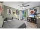 Comfortable bedroom featuring hardwood floors, a ceiling fan, and a window with natural light at 3924 Lorien Nw Way, Kennesaw, GA 30152