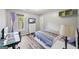 Cozy bedroom with a comfortable bed, ample natural light, and a dedicated workspace for studying or working at 3924 Lorien Nw Way, Kennesaw, GA 30152