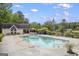 Community pool with lounge area, surrounded by lush landscaping and mature trees at 3924 Lorien Nw Way, Kennesaw, GA 30152