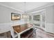 Bright dining room with wainscoting, a bay window, and wood-look flooring at 3924 Lorien Nw Way, Kennesaw, GA 30152