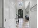 Grand foyer showcases a soaring ceiling, arched doorway, and beautiful hardwood flooring at 3924 Lorien Nw Way, Kennesaw, GA 30152