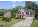 Desirable property featuring a manicured front yard and an attached two-car garage at 3924 Lorien Nw Way, Kennesaw, GA 30152