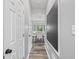 Hallway view of dining room, showing stylish floors and decorative wall art at 3924 Lorien Nw Way, Kennesaw, GA 30152
