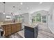 Open kitchen featuring a center island, bar seating, and stainless steel appliances at 3924 Lorien Nw Way, Kennesaw, GA 30152