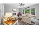 Comfortable living room with a fireplace, large windows, and cozy seating at 3924 Lorien Nw Way, Kennesaw, GA 30152