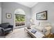 Bright living room featuring hardwood floors, large windows, and neutral decor at 3924 Lorien Nw Way, Kennesaw, GA 30152