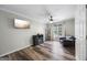 Inviting living room with wood floors, comfortable seating, and a modern entertainment setup at 3924 Lorien Nw Way, Kennesaw, GA 30152