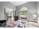 Inviting living room with hardwood floors, an arched window, and comfortable seating at 3924 Lorien Nw Way, Kennesaw, GA 30152