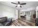 Spacious main bedroom suite with wood floors, a ceiling fan, a sitting area, and plenty of natural light at 3924 Lorien Nw Way, Kennesaw, GA 30152