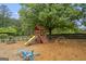 Community playground featuring a swing set, slide, climbing dome and picnic table at 3924 Lorien Nw Way, Kennesaw, GA 30152